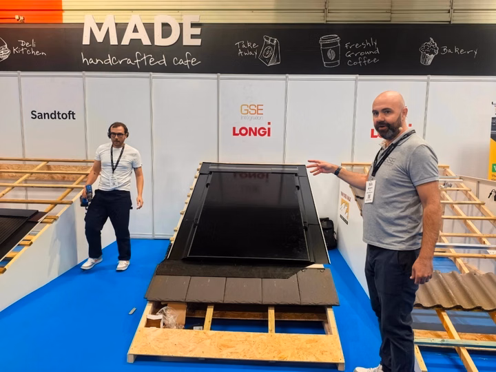 LONGi representatives at Solar & Storage Live 2025 showcasing the Hi-MO X10 solar module.