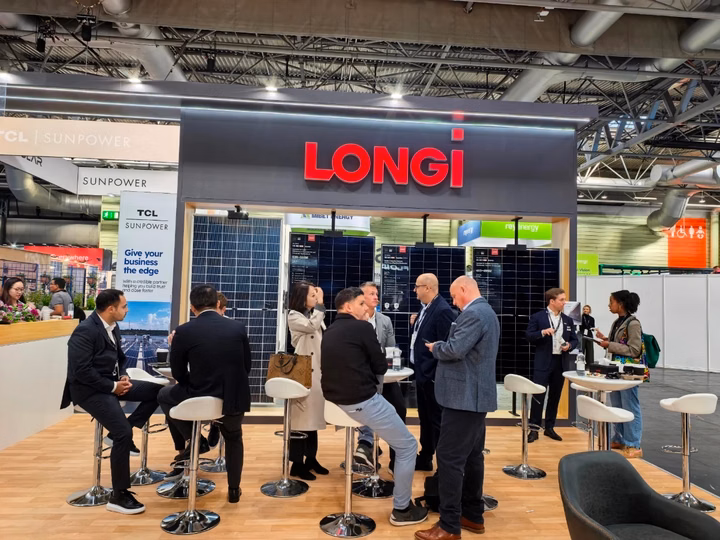 LONGi brand booth with solar panels on display at Solar & Storage Live exhibition.