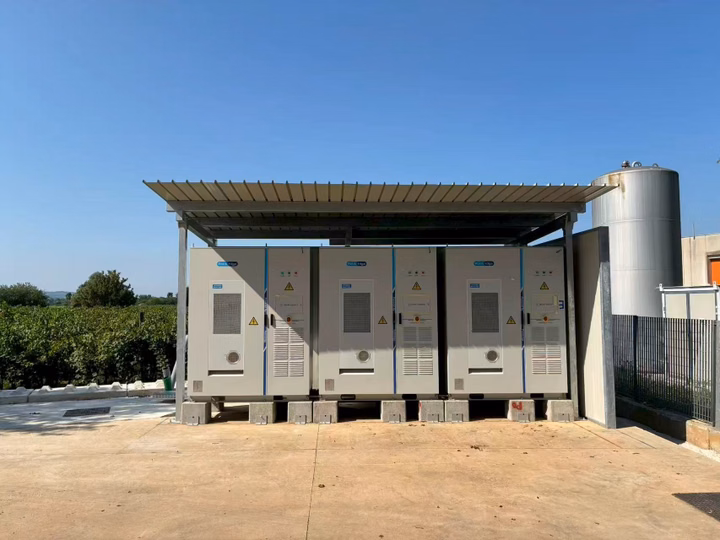 Three LONGi OmniCube A215 battery energy storage systems installed at an Italian manufacturing facility.