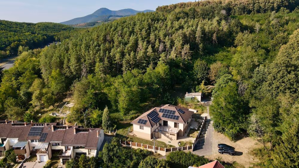 Aerial view of a Salgótarján home with a rooftop solar panel system.