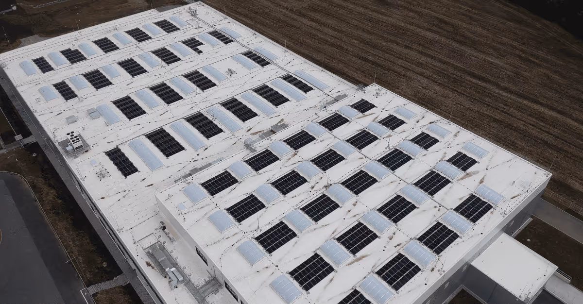 Aerial view of the industrial rooftop solar array at the SMC factory in Vyškov, Czech Republic.