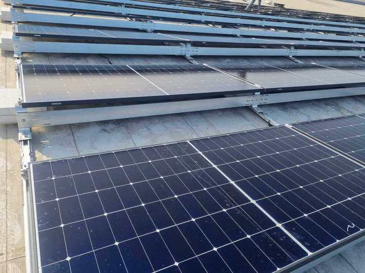 LONGi solar panels installed on the rooftop of a factory in Romania.