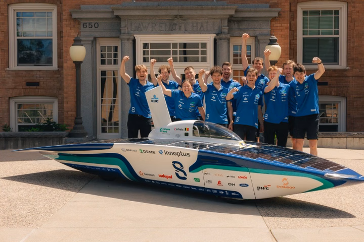 Members of the Innoptus Solar Team posing with their solar race car at the American Solar Challenge.